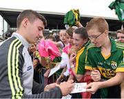 15 September 2014; Kerry's James O'Donoghue signs an autograph for Evan Maher, from Tralee, Co. Kerry after a squad training and press day ahead of the All-Ireland Senior Football Final. Fitzgerald Stadium, Killarney, Co. Kerry. Picture credit: Brendan Moran / SPORTSFILE