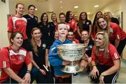 15 September 2014; Ian Millmoore, age 7 from Artane, Dublin, with members of the Cork Camogie team, during a visit by the All-Ireland Senior & Intermediate Camogie Champions to Our Lady's Children's Hospital, Crumlin. Picture credit: David Maher / SPORTSFILE