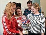 15 September 2014; Cork Camogie players Laura Tracey and Marie Walsh, with 4 month old, Andrew Rolf, with his parents Bill and Vivenne Rolf, from Belgooly, Co.Cork, during a visit by the All-Ireland Senior & Intermediate Camogie Champions to Our Lady's Children's Hospital, Crumlin. Picture credit: David Maher / SPORTSFILE