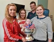 15 September 2014; Cork Camogie players Laura Tracey and Marie Walsh, with 4 month old, Andrew Rolf, with his parents Bill and Vivenne Rolf, from Belgooly, Co.Cork, during a visit by the All-Ireland Senior & Intermediate Camogie Champions to Our Lady's Children's Hospital, Crumlin. Picture credit: David Maher / SPORTSFILE