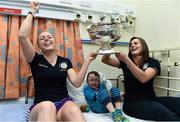 15 September 2014; Jason Harber, age 5, from Kilkenny, Co. Kilkenny, with Cork player's Joanne Casey, left, and Aoife Murray, during a visit by the All-Ireland Senior & Intermediate Camogie Champions to Our Lady's Children's Hospital, Crumlin. Picture credit: David Maher / SPORTSFILE