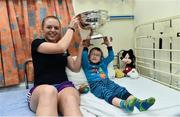 15 September 2014; Jason Harber, age 5, from Kilkenny, Co. Kilkenny, with Cork player Joanne Casey during a visit by the All-Ireland Senior & Intermediate Camogie Champions to Our Lady's Children's Hospital, Crumlin. Picture credit: David Maher / SPORTSFILE