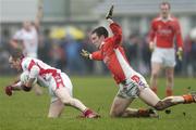 11 February 2007; Christy Grimes, Louth, in action against Brendan Donaghy, Armagh. Allianz National Football League, Division 1B, Round 2, Armagh v Louth, Oliver Plunkett Park, Crossmaglen, Co. Armagh. Photo by Sportsfile *** Local Caption ***