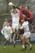 11 February 2007; Killian Brennan, left, and Anthony Rainbow, Kildare, in action against Peter Turley, right, Dan Gordon, and Brendan Coulter, Down. Allianz National Football League, Division 1B, Round 2, Down v Kildare, St. Patricks Park, Newcastle, Co. Down. Picture credit: Brian Lawless / SPORTSFILE