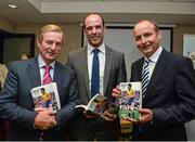 16 September 2014; An Taoiseach Enda Kenny, T.D., left, with Dermot Earley junior and Fianna Fail leader Michael Martin T.D., right, officially launched the authorised Biography of the Late Dermot Earley, entitled &quot;Dermot Earley, An Officer And A Gentleman&quot; by John Scally. Croke Park, Dublin. Picture credit: David Maher / SPORTSFILE