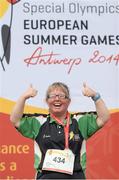 18 September 2014; Team Ireland's Philomena Doherty, from Castlefin Co. Donegal, celebrates after being presented with a Silver Medal after winning the 100m walk event at the Den UYT Sports Centre. 2014 Special Olympics European Games, Antwerp, Belgium. Picture credit: Ray McManus / SPORTSFILE