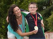 18 September 2014; Team Ireland's Conor Dwyer, from Birr, and a member of Camcor Warriors Special Olympics Club, Co. Offaly, with a family friend and coach Tracy Anne Milne after Conor had won a Gold Medal swimming at the Wezenberg Olympic swimming pool. 2014 Special Olympics European Games, Antwerp, Belgium. Picture credit: Ray McManus / SPORTSFILE