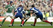 11 February 2007; Girvan Dempsey, Ireland, is tackled by Raphael Ibanez, 2, and Lionel Nallet, France. RBS Six Nations Rugby Championship, Ireland v France, Croke Park, Dublin. Picture Credit: Brendan Moran / SPORTSFILE