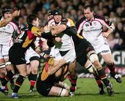 16 February 2007; Stephen Ferris, Ulster, is tackled by Ceri Sweeney and Peter Sidoli, Dragons. Magners League, Ulster v Dragons, Ravenhill Park, Belfast Co. Antrim. Picture credit: Oliver McVeigh / SPORTSFILE