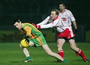 17 February 2007; Christy Toye, Donegal, is tackled by Gerald Cavlan, Tyrone. McKenna Cup Final, Donegal v Tyrone, Healy Park, Omagh, Co. Tyrone. Picture credit: Oliver McVeigh / SPORTSFILE