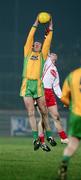 17 February 2007; Neil Gallagher, Donegal, out jumps Kevin Hughes, Tyrone, to win possession. McKenna Cup Final, Donegal v Tyrone, Healy Park, Omagh, Co. Tyrone. Picture credit: Oliver McVeigh / SPORTSFILE