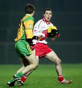 17 February 2007; Tommy McGuigan, Tyrone, in action against Ryan Bradley, Donegal. McKenna Cup Final, Donegal v Tyrone, Healy Park, Omagh, Co. Tyrone. Picture credit: Oliver McVeigh / SPORTSFILE