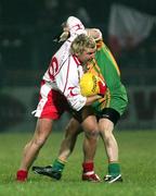 17 February 2007; Owen Mulligan, Tyrone, in action against Kevin Cassidy, Donegal. McKenna Cup Final, Donegal v Tyrone, Healy Park, Omagh, Co. Tyrone. Picture credit: Oliver McVeigh / SPORTSFILE