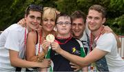 18 September 2014; Team Ireland's Conor Dwyer, from Birr, and a member of Camcor Warriors Special Olympics Club, Co Offaly, with his mother Suzanne and his brothers Stephen, Rory and David. Conor won a Gold Medal swimming at the Wezenberg Olympic swimming pool. 2014 Special Olympics European Games, Antwerp, Belgium. Picture credit: Ray McManus / SPORTSFILE