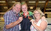 18 September 2014; Alan and Eileen Power with Team Ireland's Colleen Flood Power, from Rosslare Strand, Co Wexford, a member of Wexford Special Olympics Club, with the Gold and Silver Medals she won at the Gymnastics events at the Den UYT Sports Centre. 2014 Special Olympics European Games, Antwerp, Belgium. Picture credit: Ray McManus / SPORTSFILE