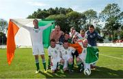 19 September 2014; Team Ireland's Conor Crowley, left, from Ballincollig, Co Cork, and a member of Ballincollig Special Olympics Club, and the Ireland team celebrate their 4-0 win over Israel in the final of the seven a side competition at the Het Rooi Sports Centre in Antwerp. 2014 Special Olympics European Games, Antwerp, Belgium. Picture credit: Ray McManus / SPORTSFILE