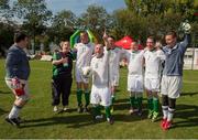 19 September 2014; Team Ireland's Peter Kavanagh, 6, from Ennis, Co Clare, who scored a hat trick, celebrates with the match ball and team mates after the game. Ireland beat Israel 4-0 in the final of the seven a side competition at the Het Rooi Sports Centre in Antwerp. 2014 Special Olympics European Games, Antwerp, Belgium. Picture credit: Ray McManus / SPORTSFILE