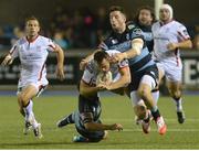 19 September 2014; Tommy Bowe, Ulster, is tackled by Lewis Jones, left, and Alex Cuthbert, Cardiff Blues. Guinness PRO12, Round 3, Cardiff Blues v Ulster. BT Sport Cardiff Arms Park, Cardiff, Wales. Picture credit: Ian Cook / SPORTSFILE
