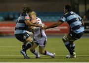 19 September 2014; Stuart Olding, Ulster, is tackled by Josh Navidi, left, and Filo Paulo, Cardiff Blues. Guinness PRO12, Round 3, Cardiff Blues v Ulster. BT Sport Cardiff Arms Park, Cardiff, Wales. Picture credit: Ian Cook / SPORTSFILE