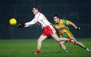 17 February 2007; Tommy McGuigan, Tyrone, in action against Barry Dunnion, Donegal. McKenna Cup Final, Donegal v Tyrone, Healy Park, Omagh, Co. Tyrone. Picture credit: Oliver McVeigh / SPORTSFILE