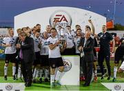 20 September 2014; Mark Rossiter, Dundalk, lifts the cup as his team-mates celebrate. EA Sports Cup Final, Dundalk v Shamrock Rovers. Oriel Park, Dundalk, Co. Louth. Picture credit: Oliver McVeigh / SPORTSFILE