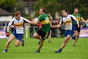 20 September 2014; Chris Clarke, Bryansford, in action against Peter Harte, left, and Ronan McRory, Errigal Ciarán. 2014 Kilmacud Crokes FBD 7s, Páirc de Búrca, Glenalbyn, Stillorgan, Co. Dublin. Picture credit: Ramsey Cardy / SPORTSFILE