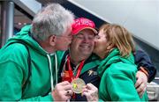 21 September 2014; Team Ireland's Paul Gordon, with parents Andy and Evelen from Omagh, Co. Tyrone, and a member of Star Breakers Special Olympics Club, with his Gold Medal he won in the 100m event, pictured at Dublin Airport on his return from the 2014 Special Olympics European Games in Antwerp, Belgium. Dublin Airport, Dublin. Picture credit: Tomás Greally / SPORTSFILE