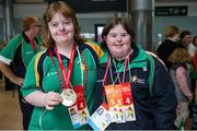 21 September 2014; Team Ireland's Katie Dillon, from Ballinasloe, Co Galway, and a member of Mountbellew Tigers Special Olympics Club, left, and Mary Zita O'Donovan, from Berrings, Co Cork, and a member of Inniscarra Blues Cork, pictured at Dublin Airport on their return from the 2014 Special Olympics European Games in Antwerp, Belgium. Dublin Airport, Dublin. Picture credit: Tomás Greally / SPORTSFILE