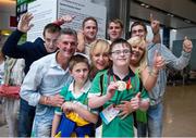 21 September 2014; Team Ireland's Conor Dwyer, from Birr, and a member of Camcor Warriors Special Olympics Club, Co Offaly, with his family, pictured at Dublin Airport on his return from the 2014 Special Olympics European Games in Antwerp, Belgium. Conor won a Gold Medal swimming at the Wezenberg Olympic swimming pool. Dublin Airport, Dublin. Picture credit: Tomás Greally / SPORTSFILE