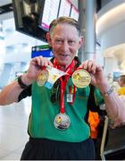 21 September 2014; Team Ireland's Thomas Comer, from Dublin, and a member of St Vincents, Navan Road, pictured at Dublin Airport on his return from the 2014 Special Olympics European Games in Antwerp, Belgium. Dublin Airport, Dublin. Picture credit: Tomás Greally / SPORTSFILE