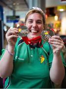 21 September 2014; Team Ireland's Carrie Doyle, from Dun Laoghaire, Co Dublin, and a member of Blackrock Flyers Special Olympics Club, who won a Silver medal in the Mixed Doubles table tennis event, pictured at Dublin Airport on her return from the 2014 Special Olympics European Games in Antwerp, Belgium. Dublin Airport, Dublin. Picture credit: Tomás Greally / SPORTSFILE