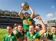 21 September 2014; Kerry's Liam Kearney lifts the Tom Markham cup as his team-mates celebrate. Electric Ireland GAA Football All Ireland Minor Championship Final, Kerry v Donegal. Croke Park, Dublin. Picture credit: Stephen McCarthy / SPORTSFILE