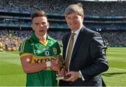 21 September 2014; Pat O'Doherty, ESB Chief Executive, presents Micheál Burns from Kerry with the Electric Ireland Man of the Match award for his outstanding performance in today's Electric Ireland GAA Football All Ireland Minor Championship Final. Croke Park, Dublin. Picture credit: Brendan Moran / SPORTSFILE