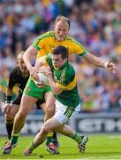 21 September 2014; Paul Murphy, Kerry, prepares to clear under pressure from Colm McFadden, Donegal. GAA Football All Ireland Senior Championship Final, Kerry v Donegal. Croke Park, Dublin. Picture credit: Ray McManus / SPORTSFILE