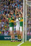 21 September 2014; Kerry goalkeeper Brian Kelly and team-mates, from left, Marc Ó Sé, Paul Murphy and David Moran defend a Donegal free during the first half. GAA Football All Ireland Senior Championship Final, Kerry v Donegal. Croke Park, Dublin. Picture credit: Ray McManus / SPORTSFILE