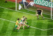 21 September 2014; Paul Geaney, Kerry, acores his side's first goal past Donegal goalkeeper Paul Durcan in the opening minutes of the game. GAA Football All Ireland Senior Championship Final, Kerry v Donegal. Croke Park, Dublin. Picture credit: Dáire Brennan / SPORTSFILE