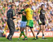 21 September 2014; Kerry's Kieran Donaghy, and member of the Kerry backroom staff Padraic Corcoran, tussle with Éamonn McGee, Donegal, during the second half. GAA Football All Ireland Senior Championship Final, Kerry v Donegal. Croke Park, Dublin. Picture credit: Stephen McCarthy / SPORTSFILE