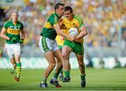 21 September 2014; Leo McLoone, Donegal, in action against Anthony Maher, Kerry. GAA Football All Ireland Senior Championship Final, Kerry v Donegal. Croke Park, Dublin. Picture credit: Piaras Ó Mídheach / SPORTSFILE