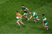 21 September 2014; Leo McLoone, Donegal, in action against Kerry players, left to right, Aidan O'Mahony, Peter Crowley and Killian Young. GAA Football All Ireland Senior Championship Final, Kerry v Donegal. Croke Park, Dublin. Picture credit: Dáire Brennan / SPORTSFILE
