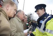 24 February 2007; Ruairi O Bradaigh, second from left, with Dan Donaghue, left, and Pat Quirke, of Republican Sinn Féin, in conversation with a Guard outside Croke Park before the Ireland v England Six Nations game. Croke Park, Dublin. Picture Credit: Brian Lawless / SPORTSFILE *** Local Caption *** Sinn Féin