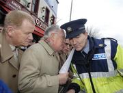 24 February 2007; Ruairi O Bradaigh, 2nd from left, with Dan Donaghue, left, and Pat Quirke, of Republican Sinn Féin in conversation with a Guard outside Croke Park before the Ireland v England Six Nations game. Croke Park, Dublin. Picture Credit: Brian Lawless / SPORTSFILE