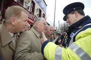 24 February 2007; Ruairi O Bradaigh, second from left, with Dan Donaghue, left, and Pat Quirke, of Republican Sinn Féin, in conversation with a Guard outside Croke Park before the Ireland v England Six Nations game. Croke Park, Dublin. Picture Credit: Brian Lawless / SPORTSFILE