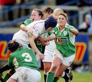 25 February 2007; Amy Garnett, England, is tackled by Marie Barrett, Sinead Ryan and Jo O'Sullivan, Ireland. Women's Six Nations Rugby, Ireland v England, Thomond Park, Limerick. Picture Credit: Kieran Clancy / SPORTSFILE