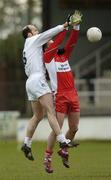 25 February 2007; Killian Brennan, Kildare, in action against James Conway, Derry. Allianz National Football League, Division 1B, Round 3, Kildare v Derry, St Conleth's Park, Newbridge, Co. Kildare. Picture Credit: Brian Lawless / SPORTSFILE