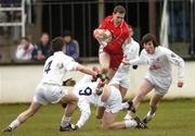 25 February 2007; Enda Muldoon, Derry, in action against Emmet Bolton, left, Mark Hogarty, and David Lyons, right, Kildare. Allianz National Football League, Division 1B, Round 3, Kildare v Derry, St Conleth's Park, Newbridge, Co. Kildare. Picture Credit: Brian Lawless / SPORTSFILE