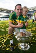21 September 2014; Declan O'Sullivan, Kerry celebrates with his son Ollie, age 2, and the Sam Maguire cup, at the end of the game. GAA Football All Ireland Senior Championship Final, Kerry v Donegal. Croke Park, Dublin. Picture credit: David Maher / SPORTSFILE