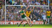 21 September 2014; Kerry's Paul Geaney takes a shot for a point despite the efforts of Frank McGlynn, Donegal. GAA Football All Ireland Senior Championship Final, Kerry v Donegal. Croke Park, Dublin. Picture credit: Brendan Moran / SPORTSFILE