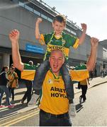 Last one of this young lad said Tralee, should be Castlemaine, Co. Kerry    21 September 2014; Phil Bonner, from Arranmore Island, Co. Donegal, and his godson Paraic Bonner, from Castlemaine, Co. Kerry, on their way to the game. GAA Football All Ireland Senior Championship Final, Kerry v Donegal. Croke Park, Dublin. Picture credit: Dáire Brennan / SPORTSFILE