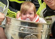 22 September 2014; Caoimhe Spillane, aged 6 months, from Killlarney, in the Sam Maguire Cup during a visit by the All Ireland Senior Football Champions 2014 to Our Lady's Children Hospital. Our Lady's Children Hospital, Crumlin, Dublin. Picture credit: Piaras Ó Mídheach / SPORTSFILE