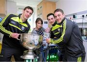22 September 2014; Michelle Dowling and Kyle McLaughlin, 19 weeks old, from Sligo Town, with Kerry footballers, from left, David Moran, Paul Murphy and Stephen O'Brien, during a visit by the All Ireland Senior Football Champions 2014 to Our Lady's Children Hospital. Our Lady's Children Hospital, Crumlin, Dublin. Picture credit: Piaras Ó Mídheach / SPORTSFILE